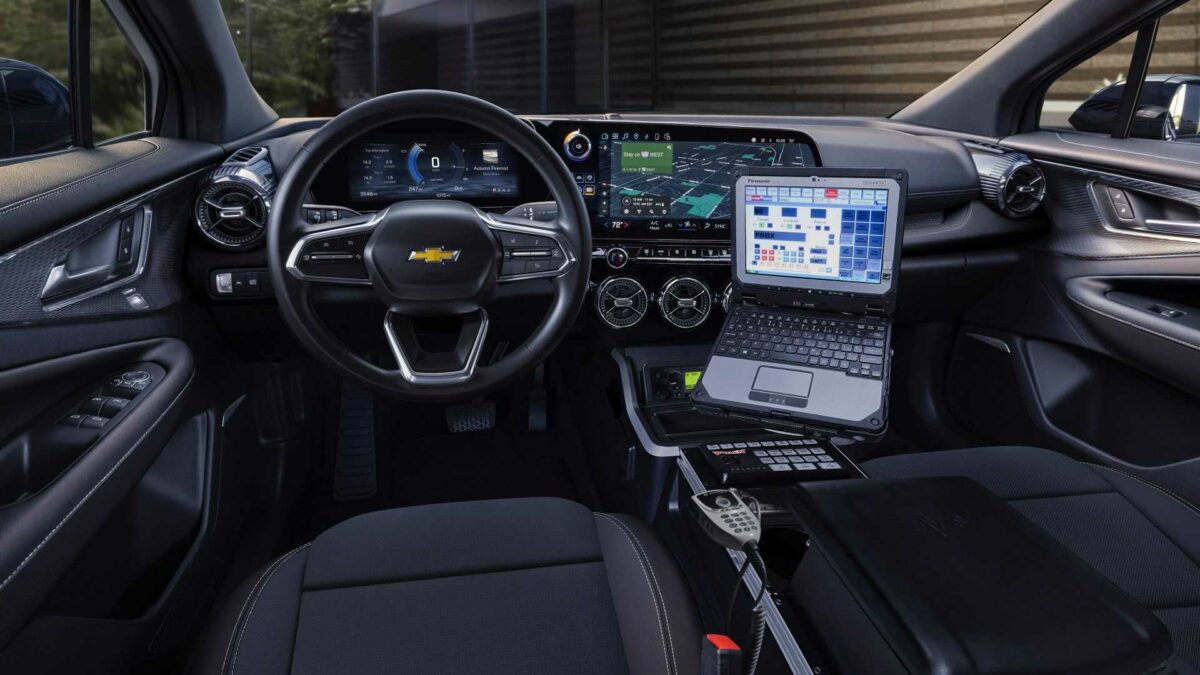 front seat view of 2024 chevrolet blazer ev ppv interior in black with havis console and laptop